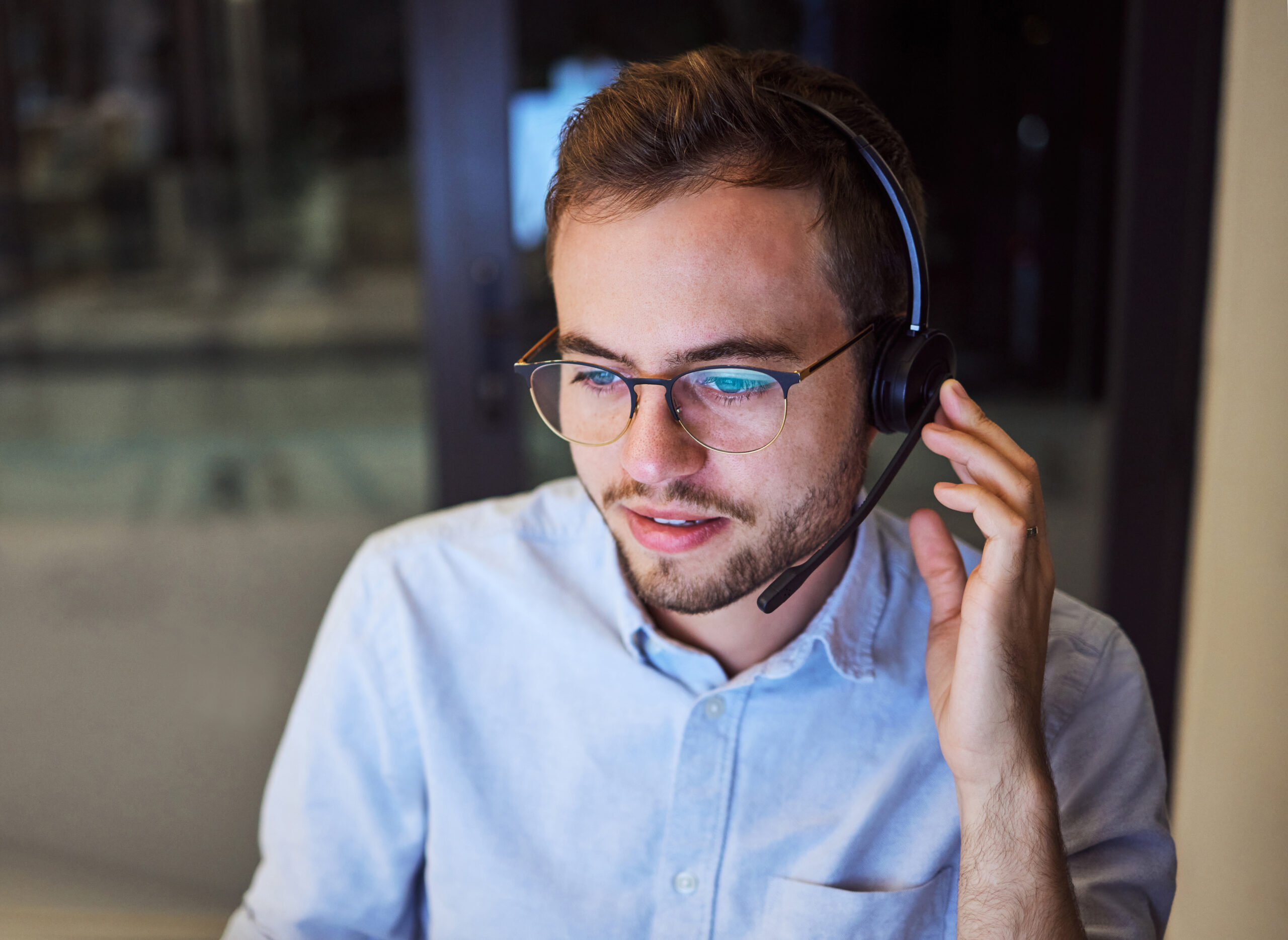Call center, customer service and telemarketing with a man working in support with a headset in his